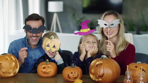 Festive Family Celebrates Halloween at Home With Masks