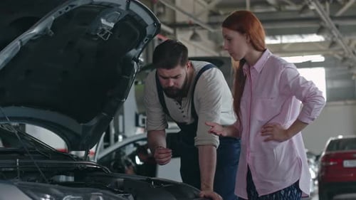 Professional Mechanic Looking Car Engine