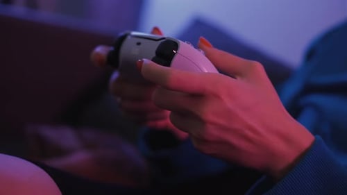 Close Up Shot of Young Woman Playing Game Online at Home