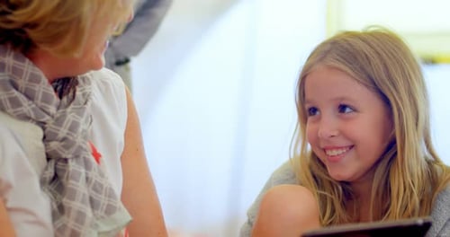 Woman and Child Using Tablet Device Together