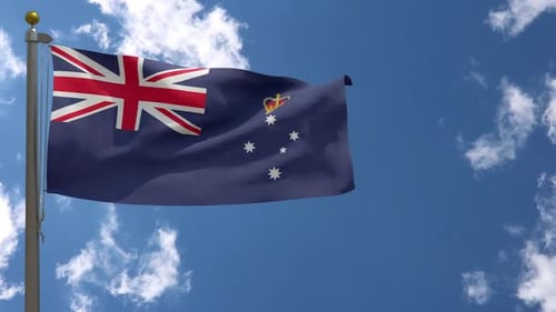 Victoria State Flag Waving Against a Clear Blue Sky