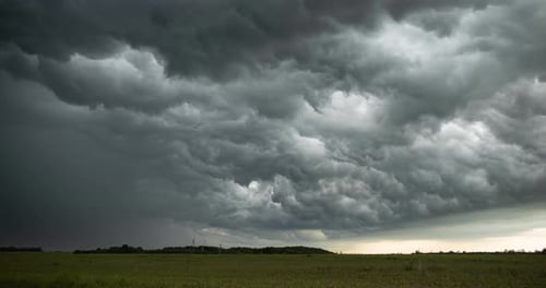 Storm Clouds Rolling over a Green Field
