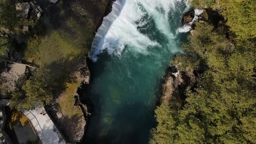 Waterfall Flowing Through the Trees Creates Foams