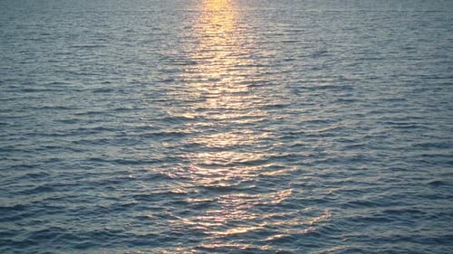 Beautiful Water Surface in Sunlight Over Horizon