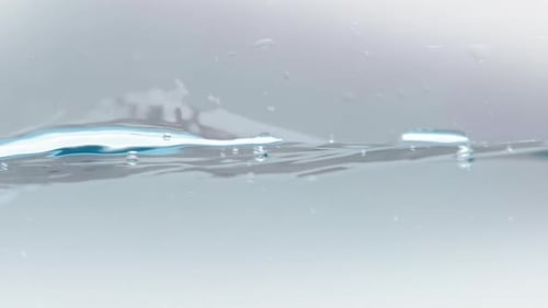 Water Surface Rippling in Light, Clear Fluid