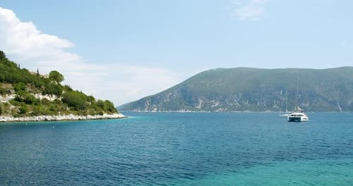 Beautiful Landscape with Green Forest and Emerald Water Lagoon of Foki Fiskardo Beach Kefalonia