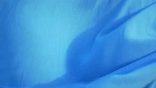 Blue fabric waving in the breeze