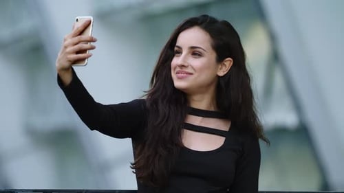 Portrait Female Using Video Call at Street. Sexy Businesswoman Using Smartphone