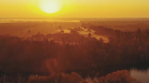 Aerial View Of Misty Autumn Field And Forest Landscape