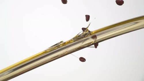 Pouring oil and seeds. Slow Motion.