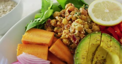 Video of close up of fresh vegetables in white bowl