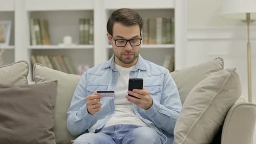 Online Shopping Failure on Smartphone By Young Man at Home