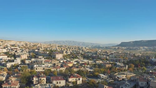 Aerial Top View of Goreme Village and Canyon Hills in Cappadocia Turkey