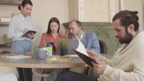 Business Professionals Collaborating in Modern Office Environment