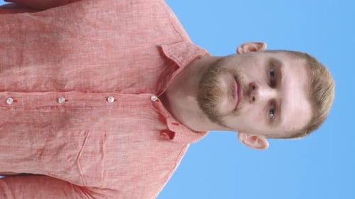 Young Man Giving Thumbs Up an Winking