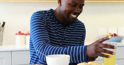Man using a digital tablet while having juice