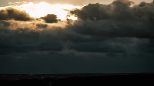Dramatic Sunset in the Sky Through Orange Layered Cumulus Clouds Timelapse