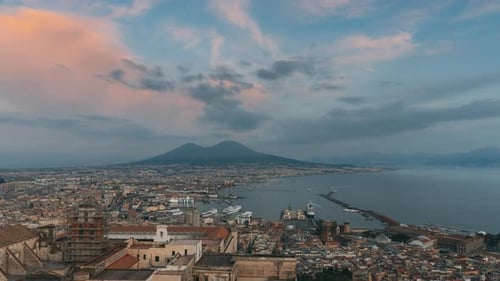 Naples, Italy. Top View Skyline Cityscape In Evening Lighting. Day To Night Transition
