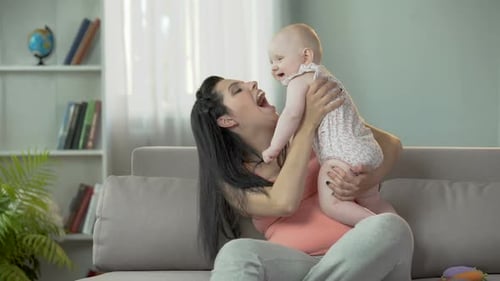 Mom and Baby Bonding on the Sofa