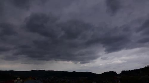 Time Lapse of Stormy Sky Over Mountain City