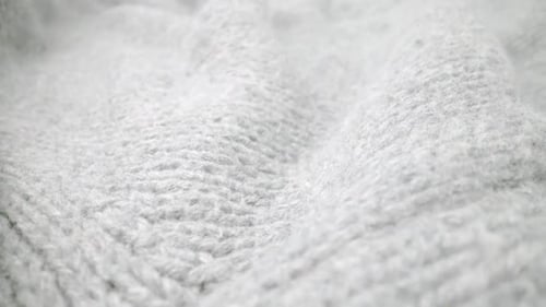 Extreme Detail View of Sheep Wool Cloth Texture Flowing in Macro Dolly Shot