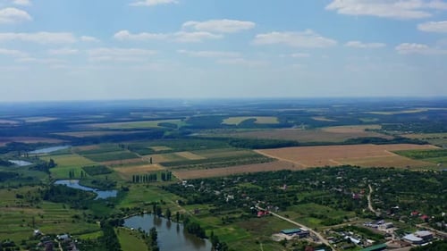 Aerial view of green countryside. Aerial view of residential area in rural town