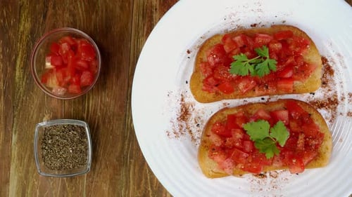 Fresh Tomato Bruschetta Toasts on White Plate