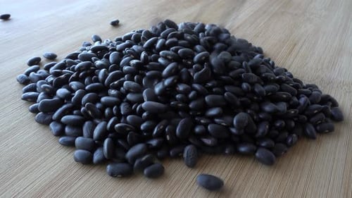 Black Beans Piled on Wooden Surface