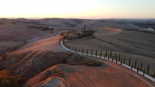 Crete Senesi Tuscan Rolling Hills, Farmhouse, and Cypress Road Aerial View in Tuscany