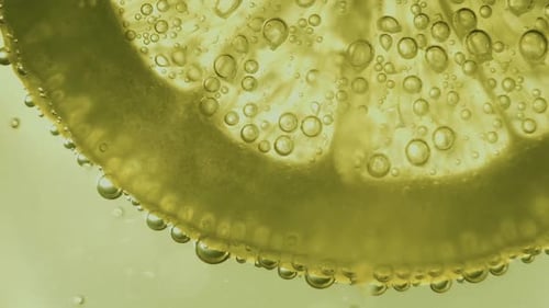 Close Up of Lemon Slice Covered in Bubbles