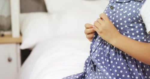 Child Buttons Polka Dot Shirt in Bright Bedroom