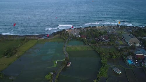 Kites Fly on the Ocean Shore Near the Rice Terraces