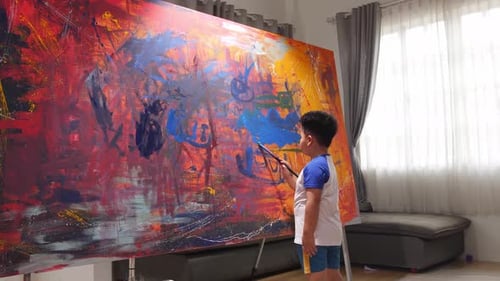 Young Child Painting Colorful Abstract Artwork on Canvas