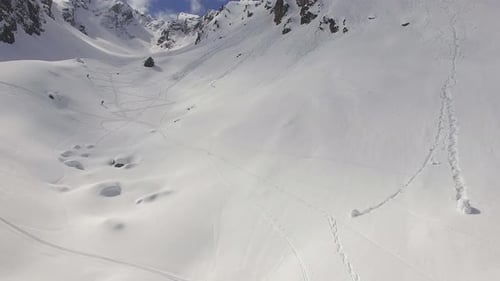 Aerial view of skiers on snow covered mountains