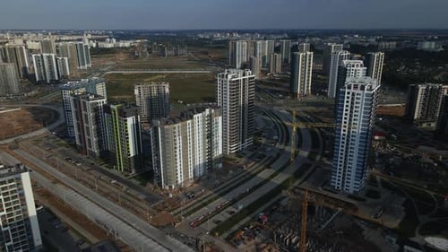 Construction of a modern city block. Multi-storey buildings