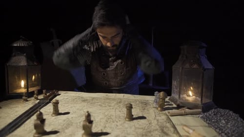 Medieval Military Leader Planning Strategy by Candlelight