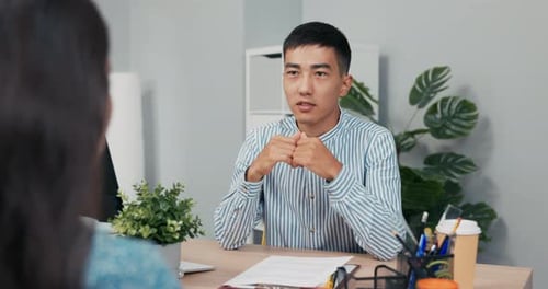 Job Interview with Disabled Woman in Wheelchair Smiling Boss Man of AsianKorean Beauty Asks