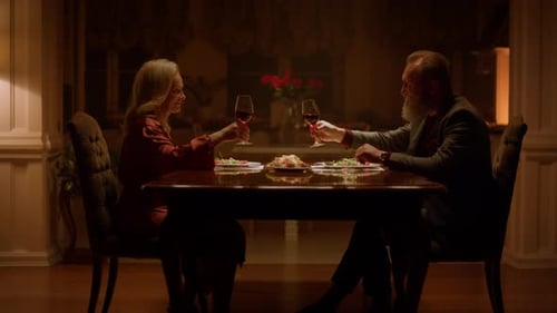 Couple Toasting Wine at a Romantic Dinner