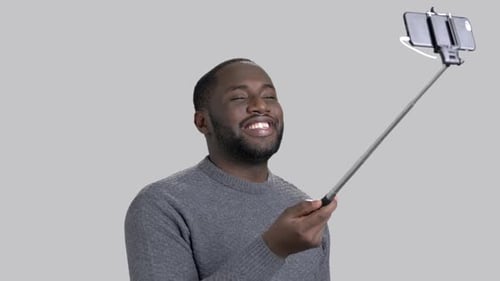 Handsome Guy Using Selfie Stick.
