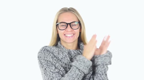 Smiling Woman Clapping with Enthusiasm on White Background