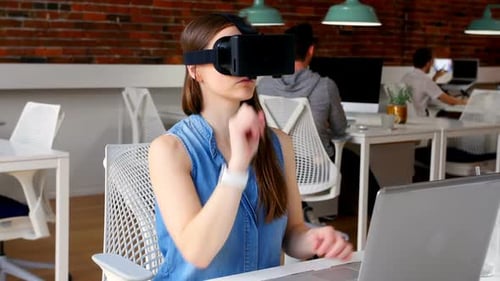 Woman Uses VR Headset in Modern Office