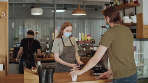 Barista Medical Face Mask in Coffee Shop Lockdown Quarantine Coronavirus is Over Back to Normal