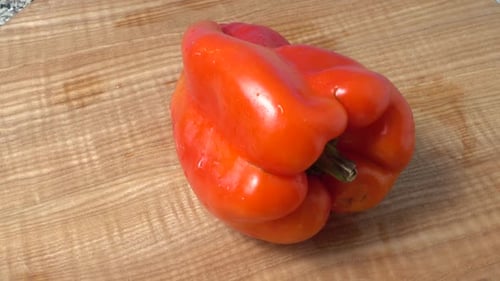 Red Pepper on Wooden Cutting Board
