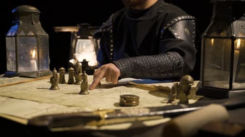 Man in Costume Planning Battle with Chess Pieces