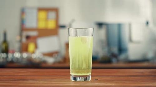 Effervescent Tablet Dissolving in Glass of Water