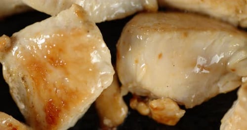 Chicken Pieces Cooking on Pan Close Up