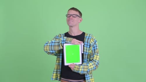 Young Adult Man Holding Tablet with Green Screen