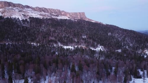 View of the beautiful snow-capped mountains on a winter day. Drone camera.