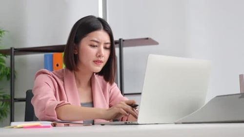 Young Asian business woman in office face portrait smile happy.