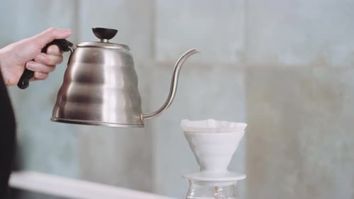 Water Pouring Into a Coffee Filter